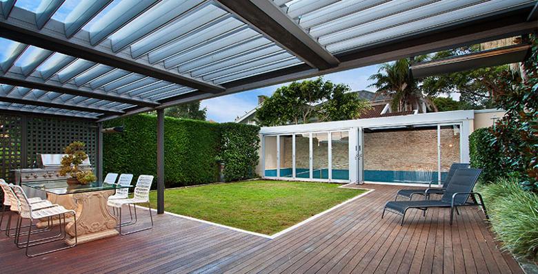 Garden exterior with pergola and roofed swimming pool